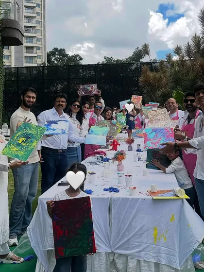 The whole family proudly displaying their unique fluid art creations. Each piece is a one-of-a-kind masterpiece, just like the little artists who made them.