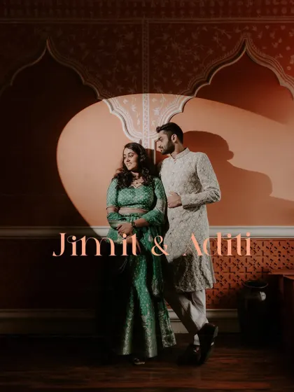 A dramatic couple portrait using a spotlight against a beautifully patterned wall, creating a theatrical feel for this pre-wedding event.