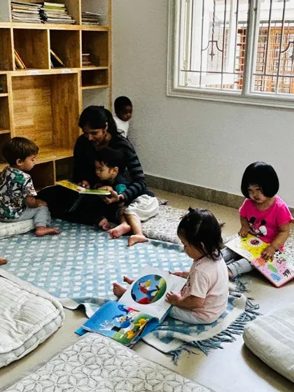 Our cozy reading corner, where children can relax on cushions and explore books independently or with a teacher.