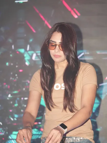 A stylish shot of me in sunglasses, focused on the mix at Ibiza Jhansi. This captures the cool, confident persona I embody during my performances.