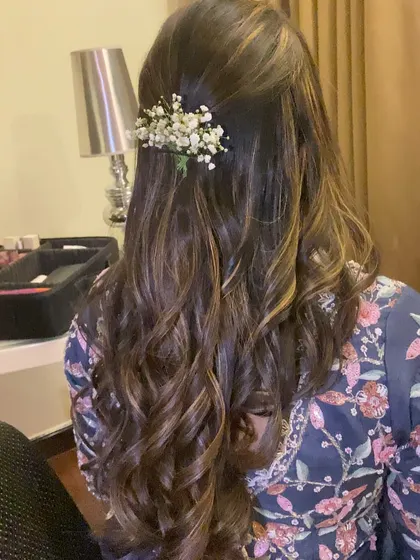 This hairstyle is perfect for an engagement or reception, offering a balance of elegance and modern style.