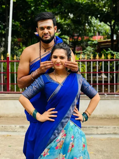 Another cute pose in the blue floral half saree, perfect for social media pictures.