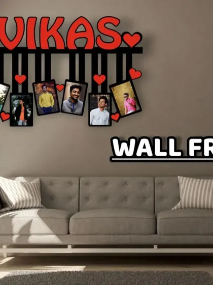 A simple yet stylish wall frame design. It features a name in bold red letters and has space for five photos hanging below.