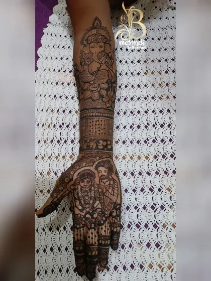 A duplicate shot of the design that merges a couple portrait with a Ganesha figure, showing how different important elements can be woven into one cohesive piece.