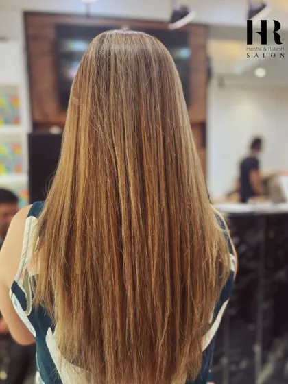A stunning blonde balayage on long hair, demonstrating my technique for achieving a bright, beachy look.