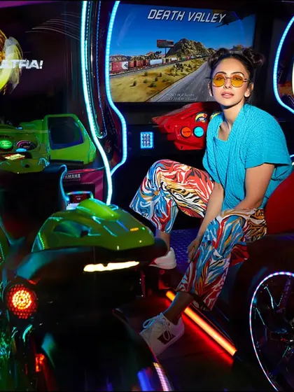 For this Hello! Magazine editorial, we placed Rakul Preet Singh in a vibrant, neon-lit arcade. The playful setting and colorful styling create a fun, high-energy fashion portrait.