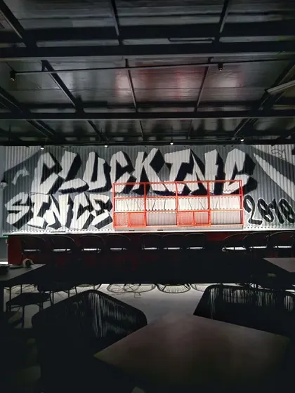 A moody shot of the graffiti mural, showing how it looks in the restaurant's low-light evening ambiance.