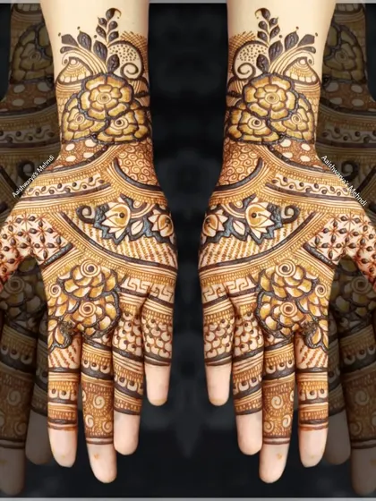 A full and intricate floral design covering both hands, showing how to create a dense yet beautiful pattern.