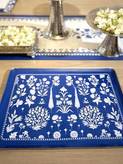 Sweets, sips, and stories are best served in style. This square tray from The Royal Malabar Collection features intricate floral motifs in a classic blue and white palette, bringing a touch of heritage to your festive table.