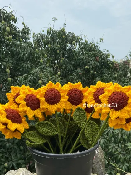 The sunflower bouquet arranged in a pot, a perfect piece of home decor.