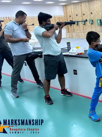 Participants in action during the open sight rifle competition at the Marksmanship Summit. Events like these are crucial for building a strong and competitive shooting community.