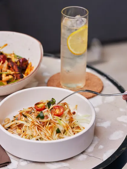 A vibrant raw papaya salad, full of fresh, tangy flavours and a bit of crunch. It’s a light and healthy dish that doesn't compromise on taste.