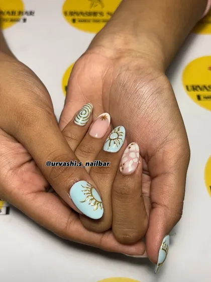 A celestial-inspired set with a dreamy pastel palette. I hand-painted sun motifs, stars, and swirls, combining different designs for a whimsical and artistic manicure.
