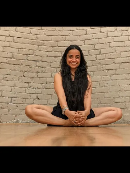 Our founder, Sahiba, sits in a butterfly stretch, embodying the grace and mindfulness we teach. The X Sense course is about the journey, including the moments of quiet focus.