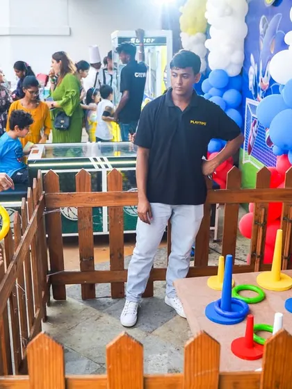 A classic ring toss game with elephant-shaped targets, a fun challenge for guests of all ages at a Sonic-themed party.