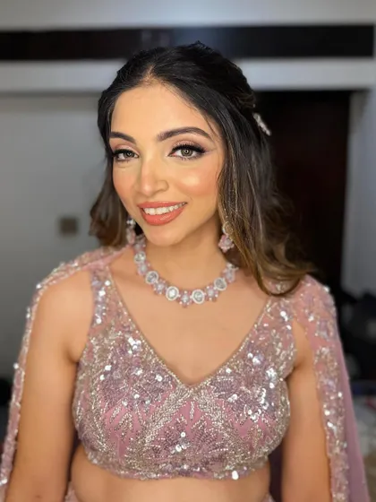 A close-up of the makeup, showing the flawless base and the beautifully blended pink eyeshadow.