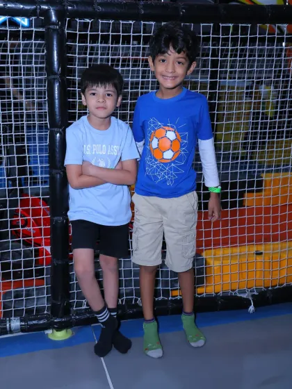 Two friends posing for a photo, showcasing the friendships that are built and strengthened through play.