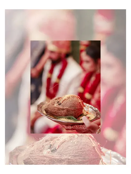 A detail shot of a coconut on a silver plate, a common and sacred element in Hindu wedding rituals.