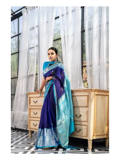 A full-length view of the elegant indoor saree portrait, showing the beautiful drape of the fabric and the classic, poised stance.