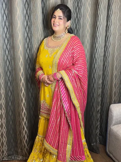 Kajol looks radiant and happy, ready for her Shagan ceremony. The makeup is bright and fresh, matching the joyous mood.