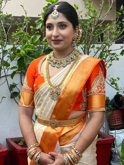 A three-quarter view showing the balance of the makeup. The eyes are defined but not heavy, and the skin is luminous, creating a fresh and modern take on a traditional look.