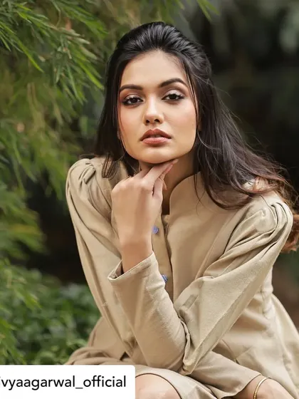 Divya Agarwal looking poised and elegant in our custom-designed tunic dress. The high collar and structured shoulders create a sophisticated silhouette.