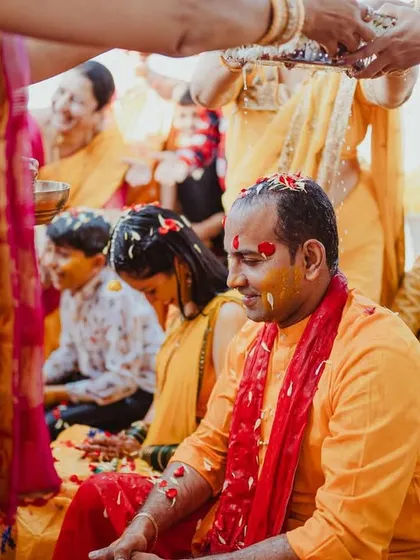 A traditional Haldi ritual, with family members performing the ceremony.