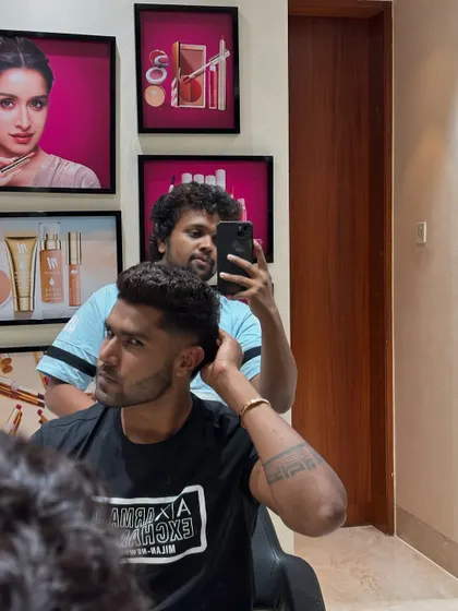 Harshit Rana checking his new style.