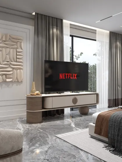 The TV and console area, designed with clean lines and sculptural art. The design maintains the room's elegant and uncluttered aesthetic while providing for modern entertainment needs.