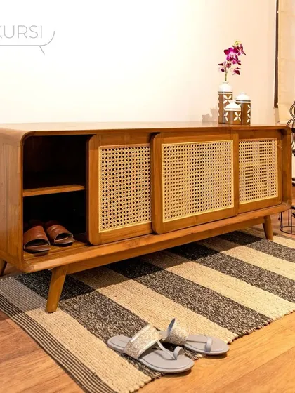 Another view of the 'Penthes' shoe rack, a piece that adds richness and depth to a foyer space.