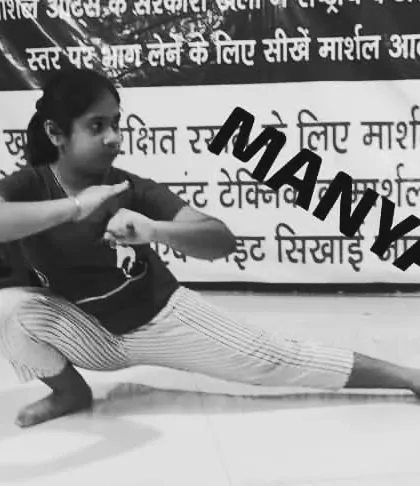 My student Manya in a deep horse stance. This fundamental pose builds lower body strength and stability, the root of all power in Kung-Fu.