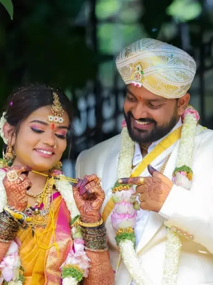 A playful and loving interaction between the couple during their wedding ceremony. These are the candid moments that truly reflect their personalities.