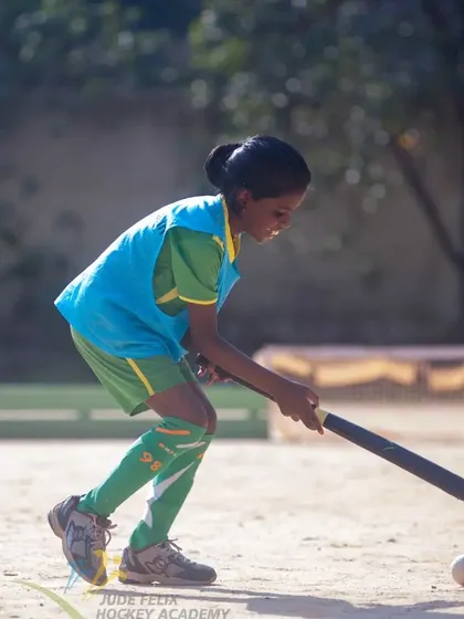 A young girl from our 2022 camp, focused on her dribbling technique.