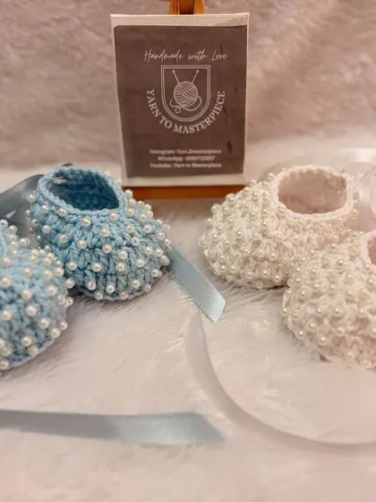 My pearl-studded booties are one of my most requested items, and here you can see why they're so versatile. I can create them in classic white for formal events or in soft pastels like this baby blue for a touch of color.