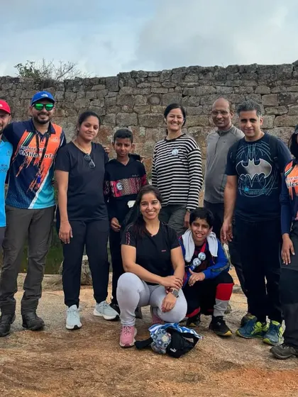 A group of our instructors and team members posing near a historic stone wall. We are a team united by our love for the trail.