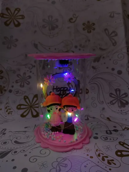 A view of the couple LED showpiece in the dark, where the colorful lights truly shine and create a beautiful ambiance.