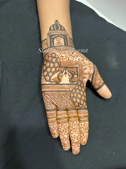 The nearly finished design, with the fingers also filled with beautiful lotus patterns.