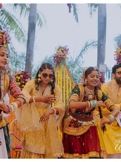 The couple joins in for a Ghoomar dance at their Rajasthani-themed Haldi, fully embracing the cultural experience we curated for them.