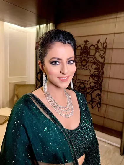 A portrait of the client, her makeup looking flawless and ready for a night out.