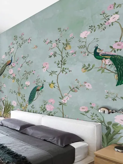 Our Traditional Peacock Harvest Garden wallpaper serves as a stunning headboard accent in this bedroom. The design brings a touch of nature and traditional art, creating a peaceful sleeping environment.