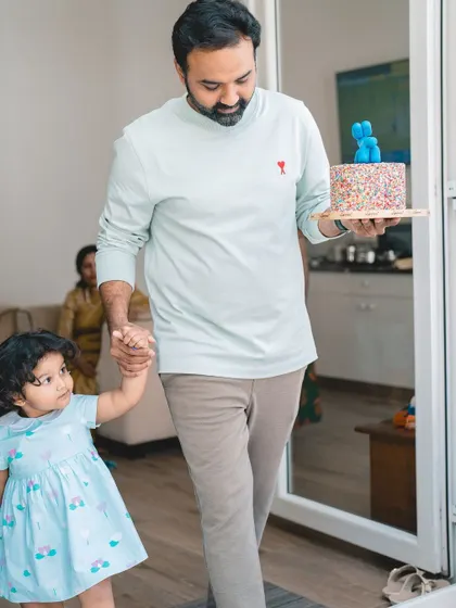 Here comes the cake. Capturing a toddler's birthday party at home allows for authentic, story-telling images of your family's special day.