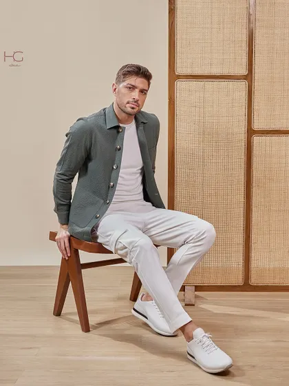 This olive green shacket, styled with white cargo pants, creates a relaxed yet elevated look perfect for a casual dinner or weekend outing.