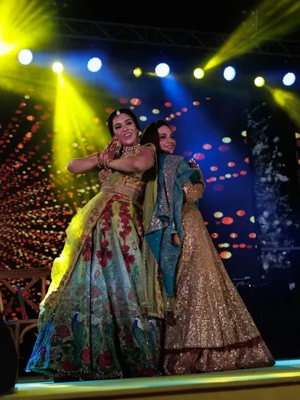 A mother-daughter duo having a blast during their Mehendi performance. Their bond is so special.
