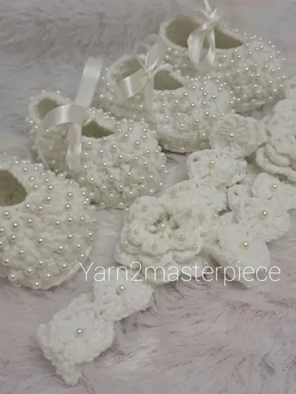 A special order for twins, this set includes two pairs of my white pearl booties and two matching floral headbands, ensuring they are perfectly coordinated.