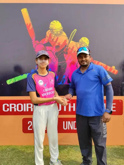 A young girl participating and receiving an award, showing that cricket is a game for everyone at our tournaments.