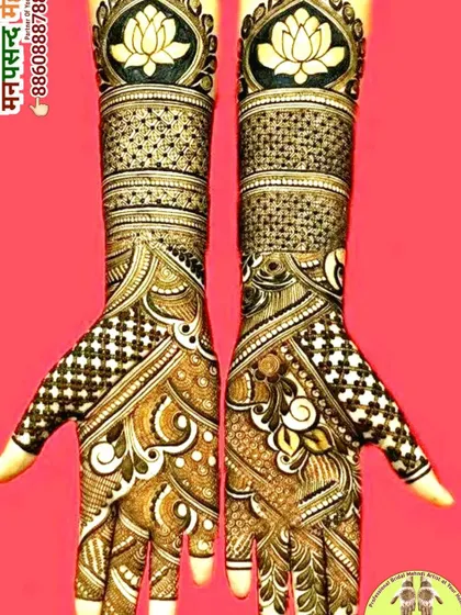 A gorgeous Arabic-style design with bold lotus motifs at the top. The flowing patterns and intricate check-work on the palms create a very elegant and contemporary feel.