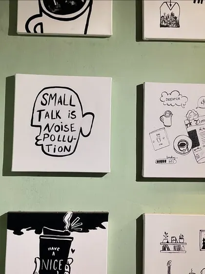 More of the black and white custom art from the Sidewalk Cafe installation. Each 12 by 13 inch canvas features a unique design related to cafe culture.