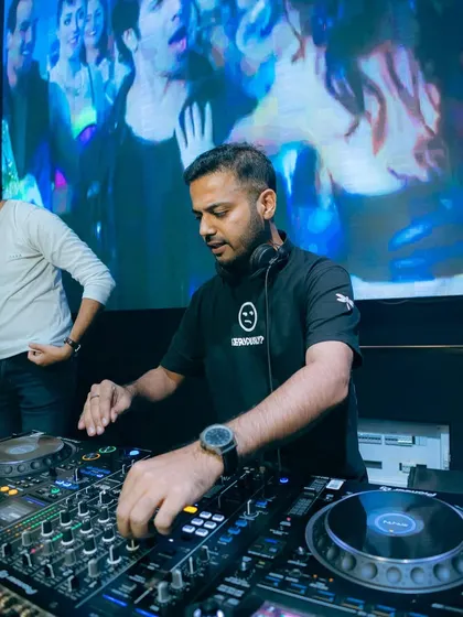 Another focused shot from my set at Vagalume Goa, showing my hands on the decks.