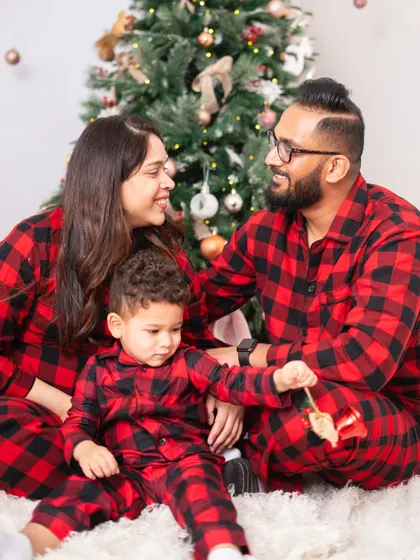 Snuggling up in matching pajamas under the Christmas tree. These cozy, candid family moments are what the holidays are all about, and I love capturing them for you.
