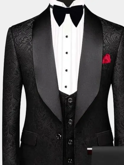 A black tuxedo jacket with a subtle self-patterned fabric. It adds a layer of texture and sophistication to the classic black tux.
